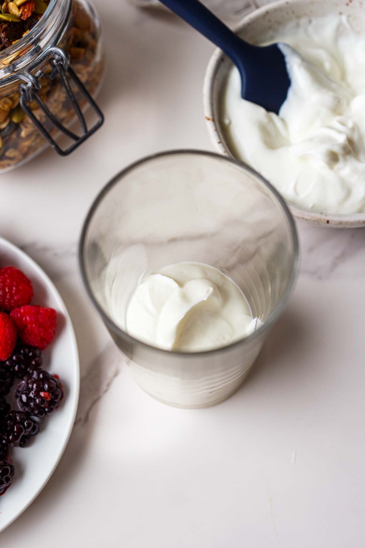 glass jar of yogurt.