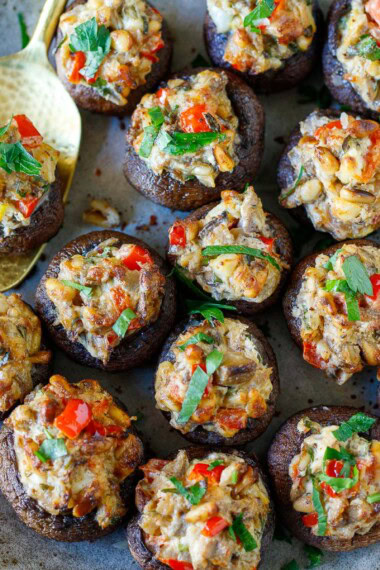 These stuffed mushrooms are elegant, crowd-pleasing, and easy to make—a catering favorite made with pine nuts, fresh herbs, lemon zest, and cream cheese. Gluten-free and vegan-adaptable!
