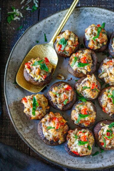 These stuffed mushrooms are elegant, crowd-pleasing, and easy to make—a catering favorite made with pine nuts, fresh herbs, lemon zest, and cream cheese. Gluten-free and vegan-adaptable!