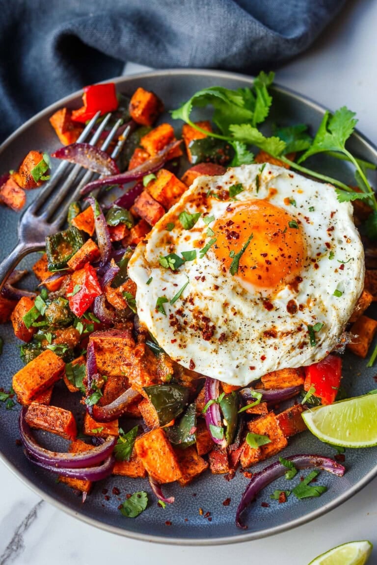 Golden, caramelized, and bursting with savory flavor—this Sheet Pan Sweet Potato Hash is my secret weapon for brunch, dinner, or anytime I want comfort without the fuss. Vegan & gluten-free.