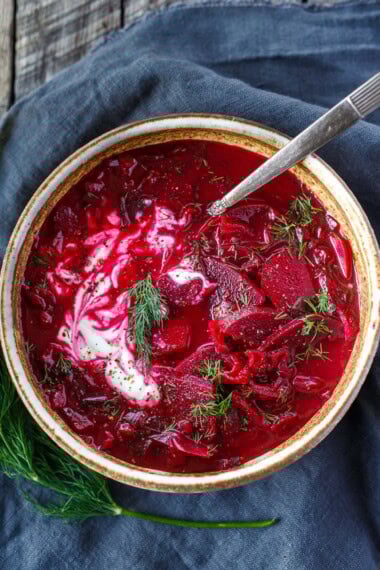 This vegetarian borscht recipe is easy, wholesome, and full of nourishing vegetables. Inspired by traditional Eastern European borscht, this version is meatless yet deeply flavorful, with earthy beets, fresh dill, and a tangy-sweet balance. Make it on the stovetop or in an Instant Pot. Chef-tested and reader-approved. Video.