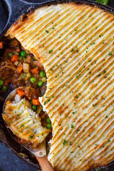 Cozy, comforting Cottage Pie made with sweet, velvety caramelized onions, veggies, ground meat, and a fluffy gruyere-potato crust. Gluten-Free.
