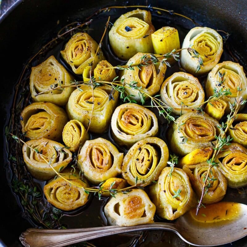These tender braised leeks are a delicious, easy, flavorful vegetable side that just melts in your mouth. Made with simple ingredients, they are vegan and gluten-free.