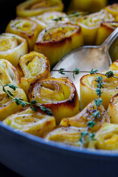 braised leeks in a braiser.