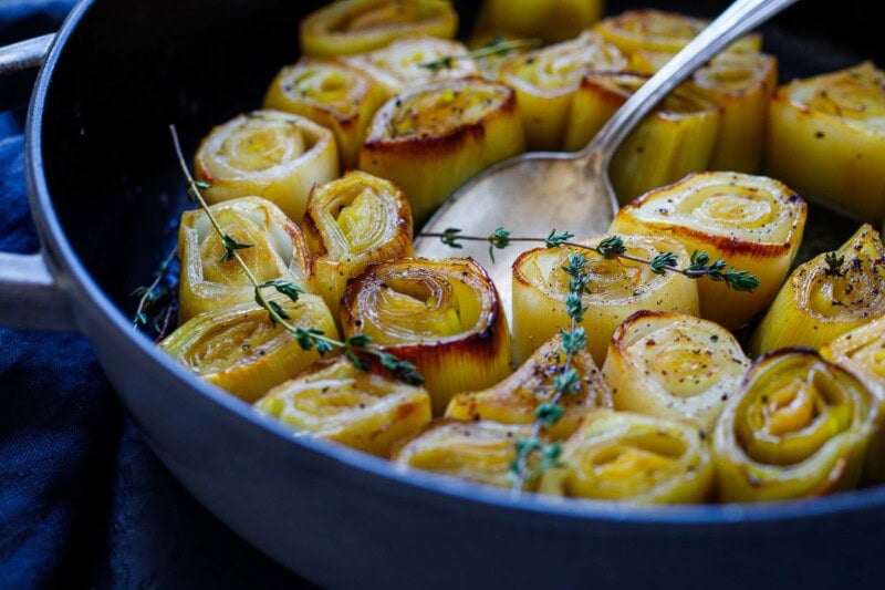 braised leeks in a braiser.