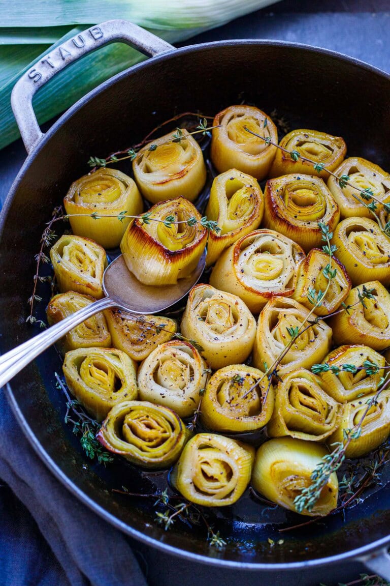 These tender braised leeks are a delicious, easy, flavorful vegetable side that just melts in your mouth. Made with simple ingredients, they are vegan and gluten-free.