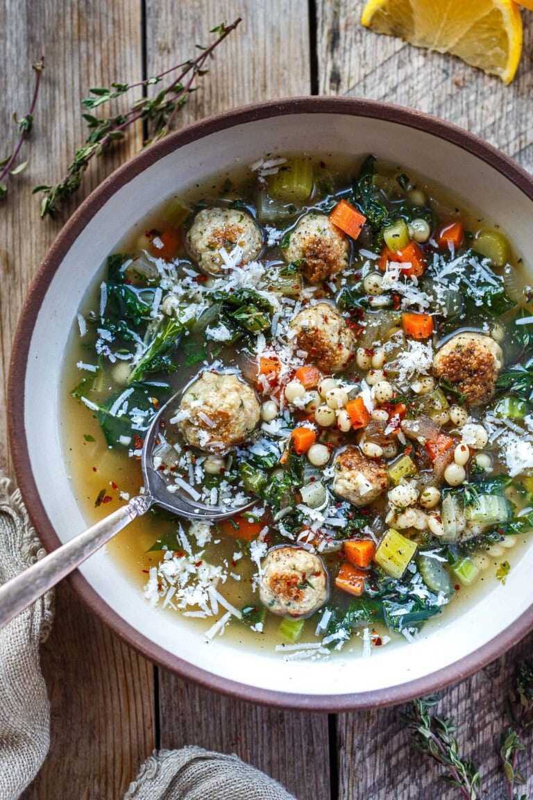 This Italian wedding soup recipe is a cozy, soul-warming classic! Ours is made with tender mini meatballs, delicate pasta, and kale in a rich, savory broth. Light yet deeply comforting, every spoonful is balanced, nourishing, and full of old-world Italian flavor.