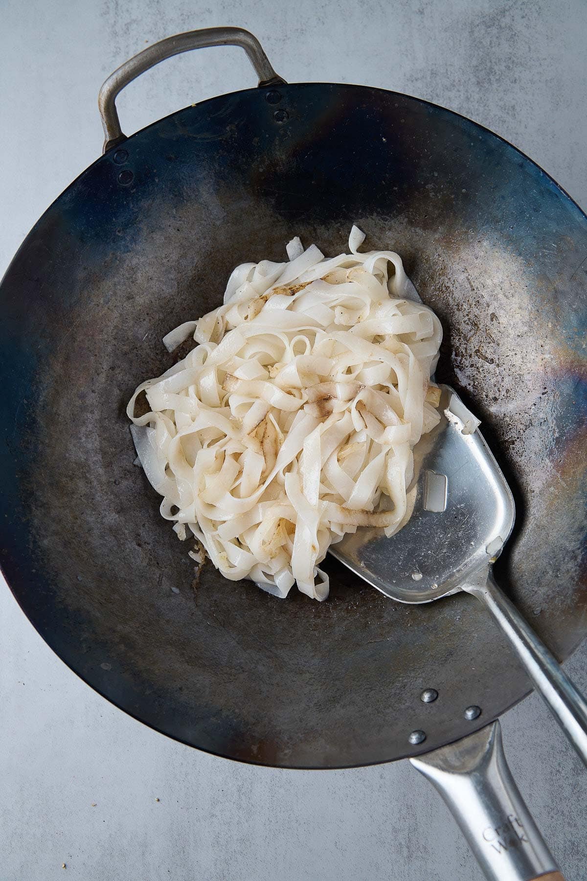 rice noodles in wok. 