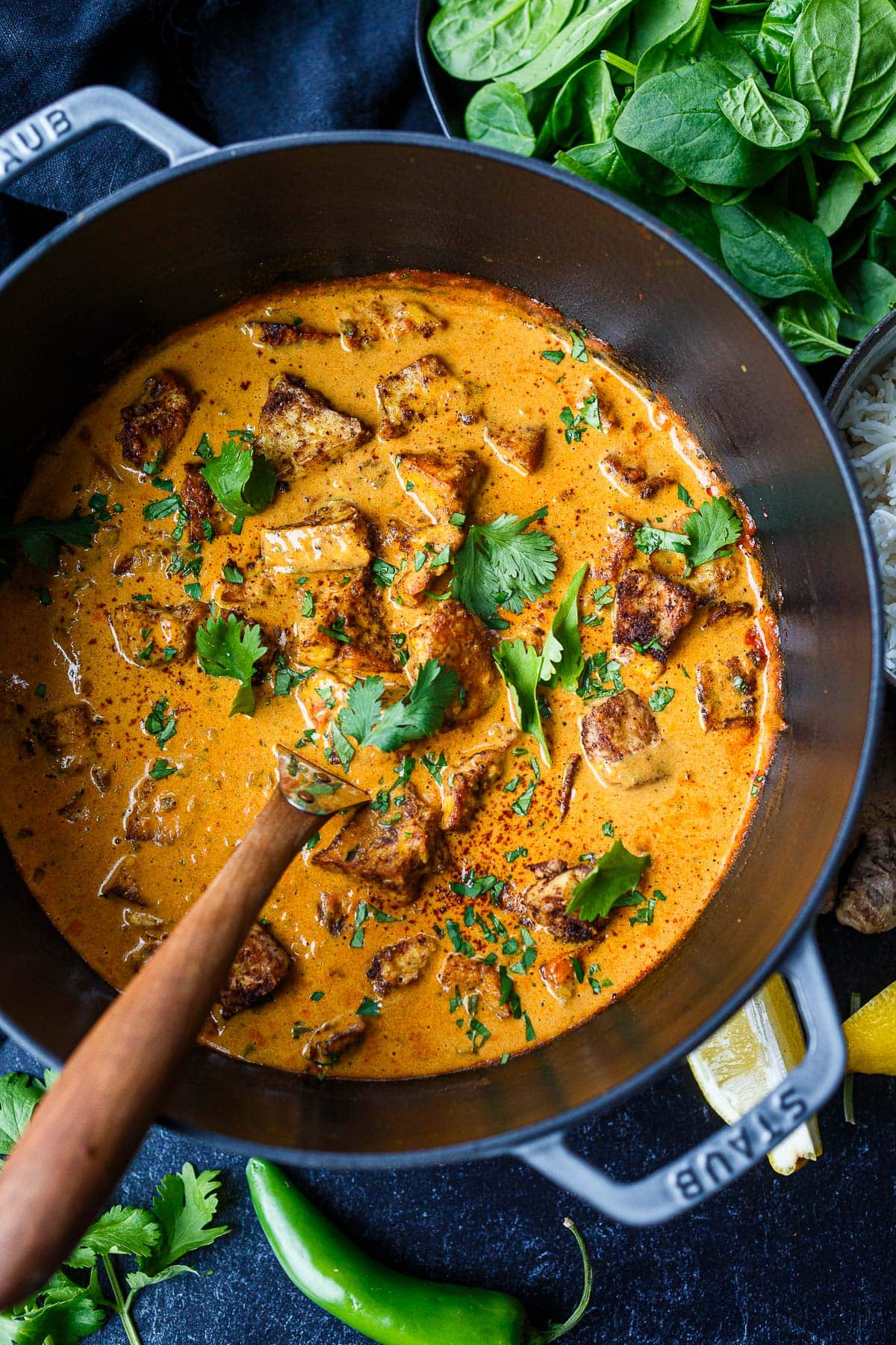 large pot of butter tofu garnished with cilantro.