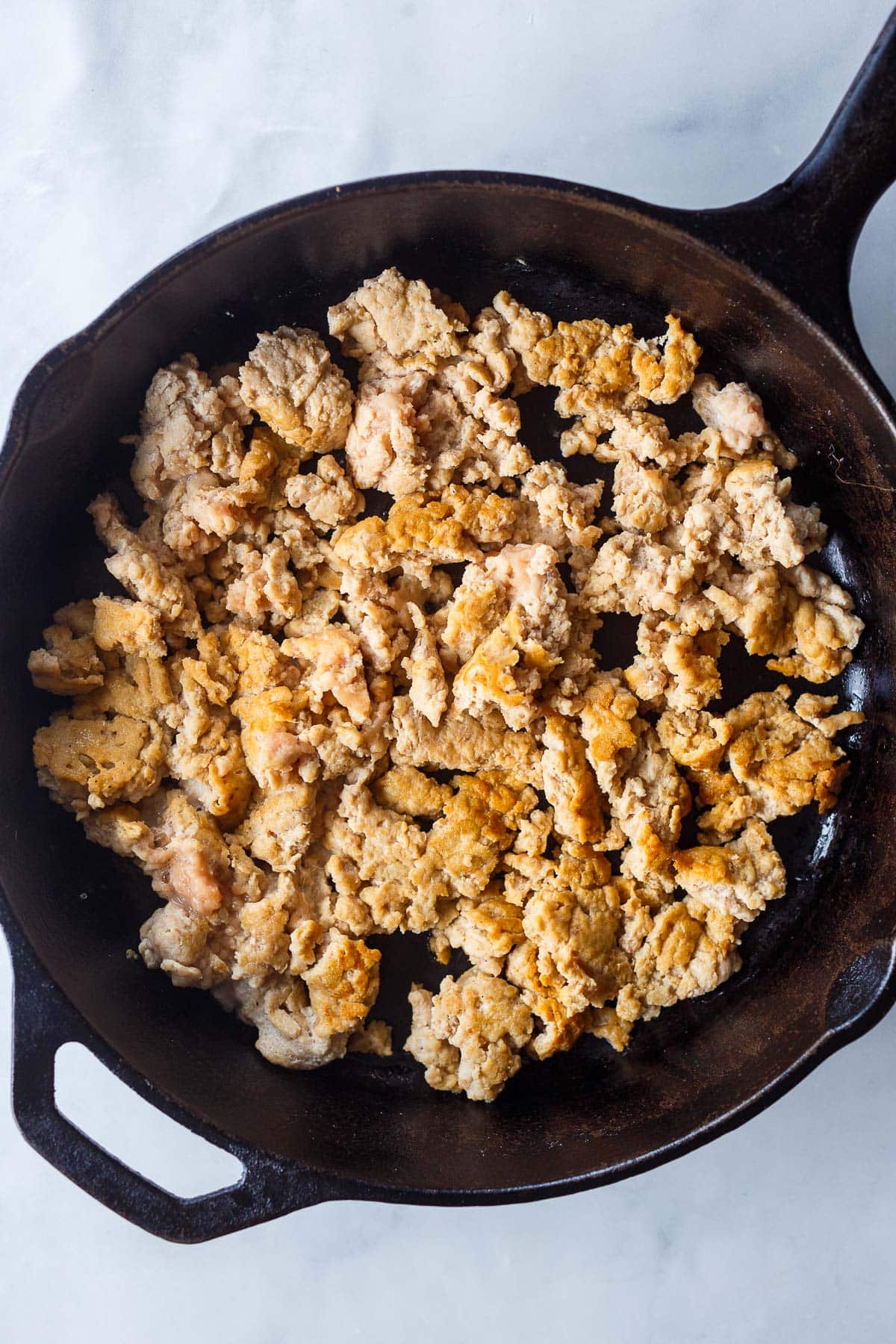 browning ground chicken in cast iron skillet. 