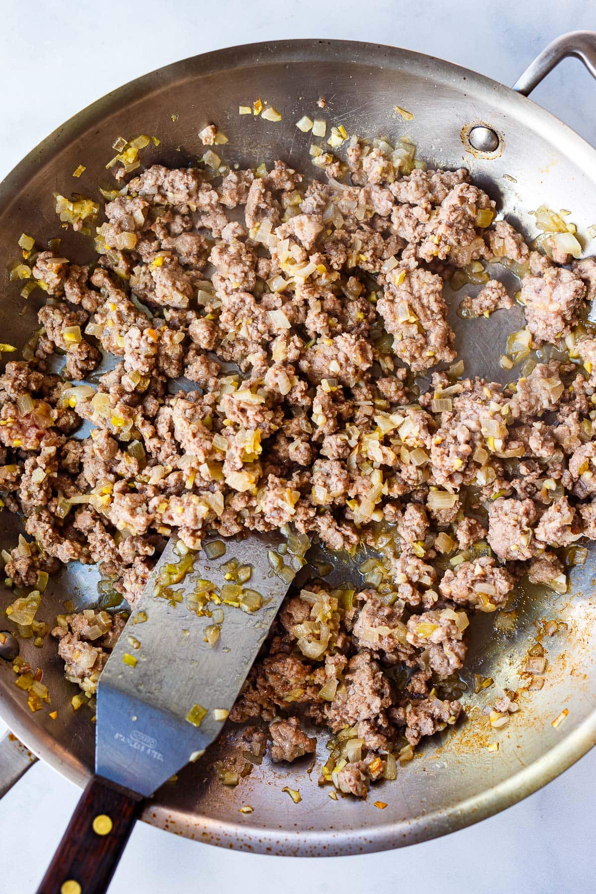 stir frying the ground turkey and onions.