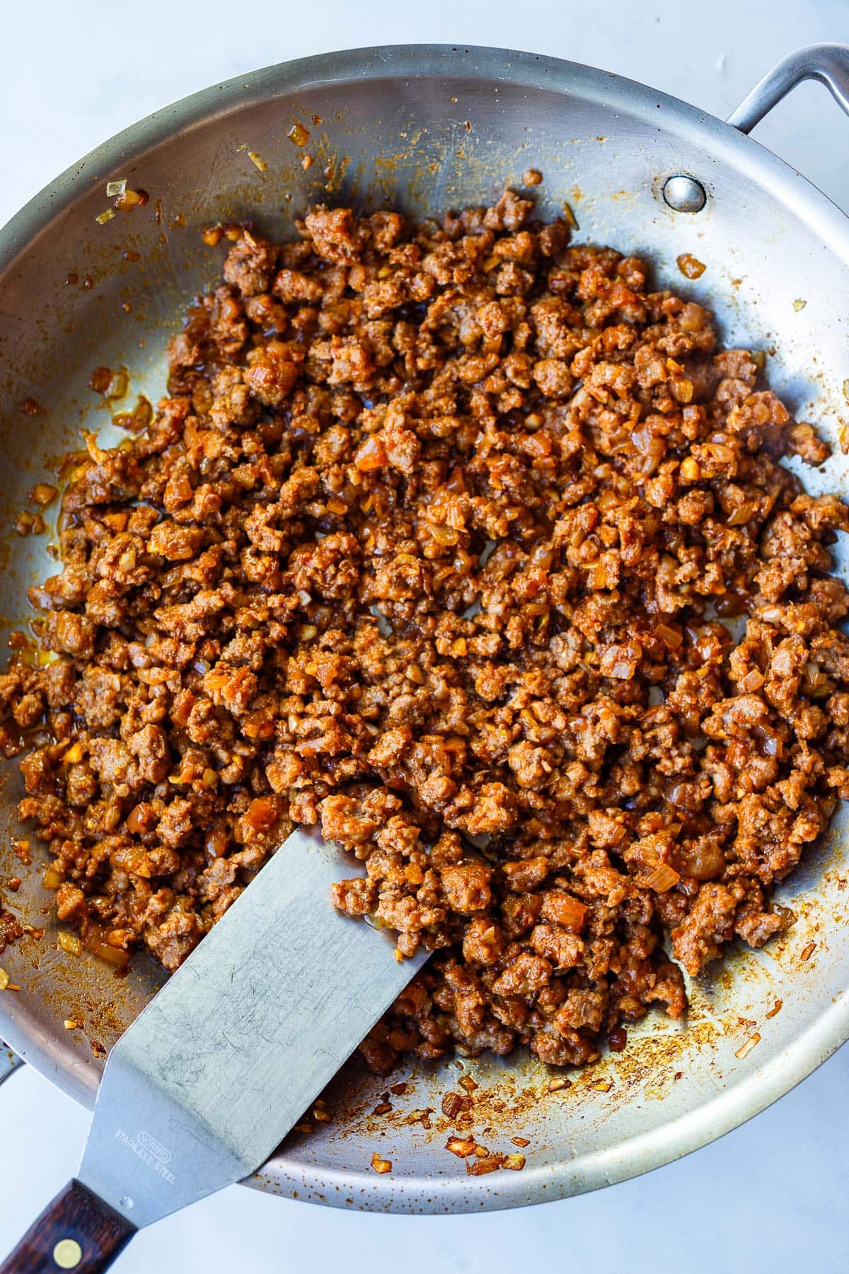 skillet with gochujang ground turkey filling and spatula.