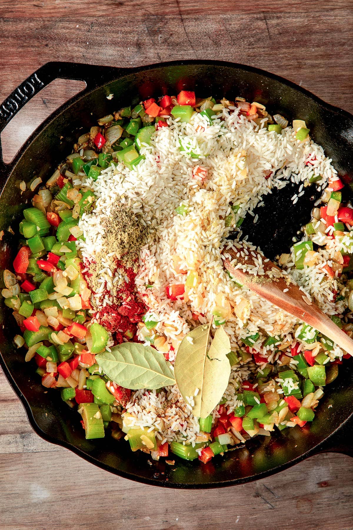 stirring the rice and veggies.