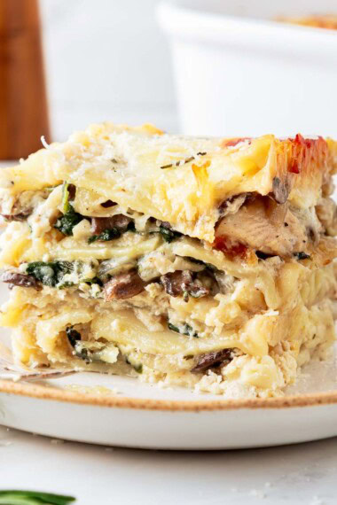 A delicious, cozy recipe for Rosemary Chicken Lasagna with mushrooms and spinach in a creamy Béchamel Sauce. A hearty meal perfect for special gatherings or Sunday supper. Vegetarian-adaptable. Video!