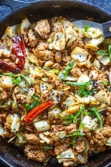 This Chicken Cabbage Stir-Fry is simple, bold, and seriously satisfying! Delicious on its own or spooned over rice or rice noodles, it's a quick, easy weeknight dinner.