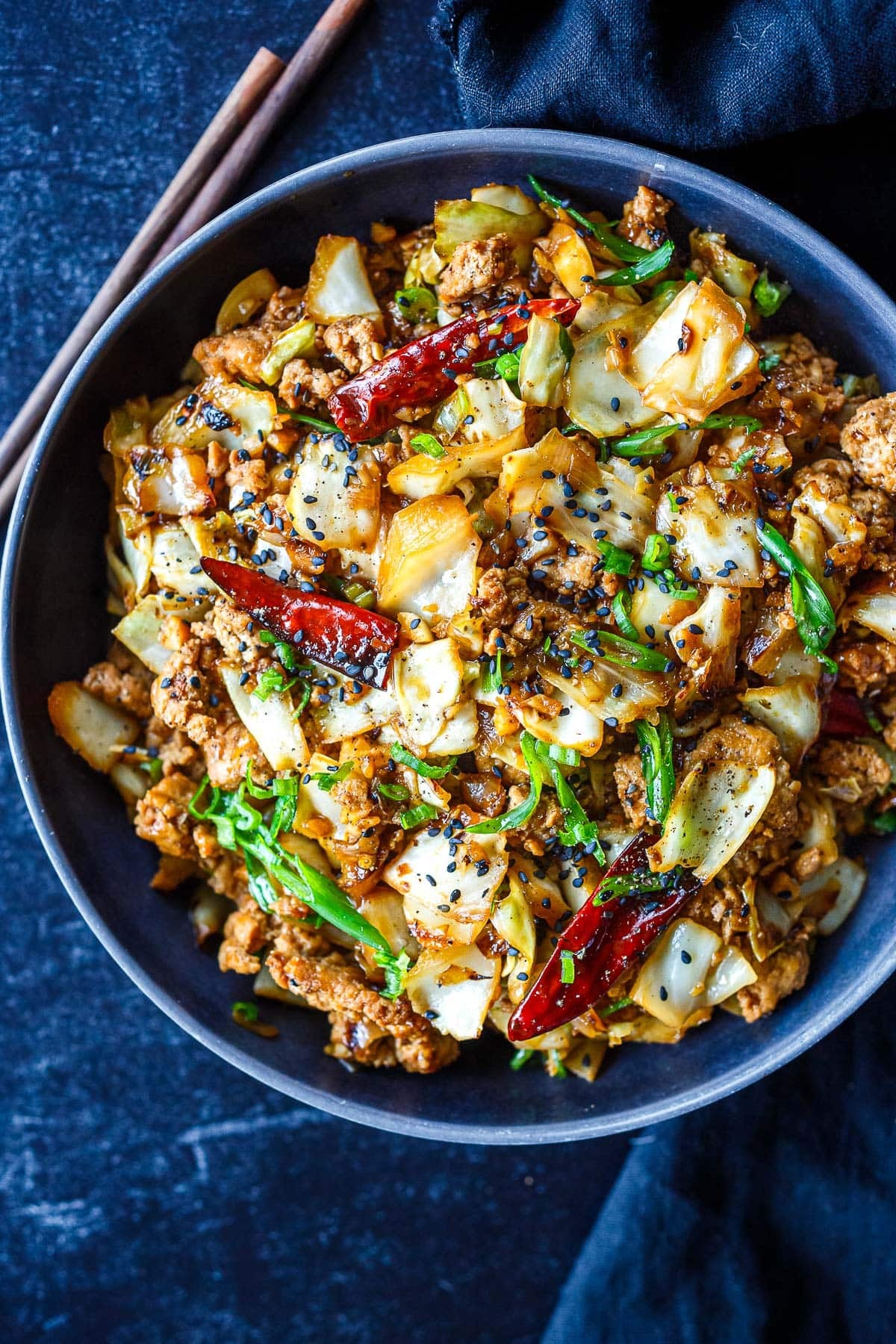 This Chicken Cabbage Stir-Fry is simple, bold, and seriously satisfying! Delicious on its own or spooned over rice or rice noodles, it's a quick, easy weeknight dinner.