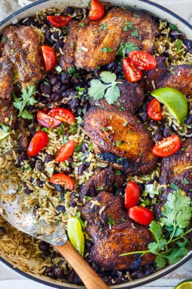 This one-pan Mexican chicken and rice with black beans features seared, spice-rubbed chicken thighs nestled into savory sofrito rice. A hearty, flavorful dinner ready in under an hour.