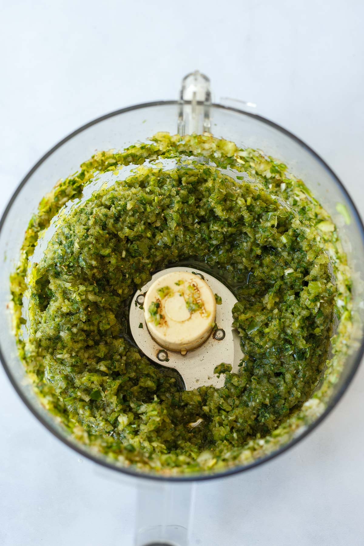 food processor with green veggie herb paste. 