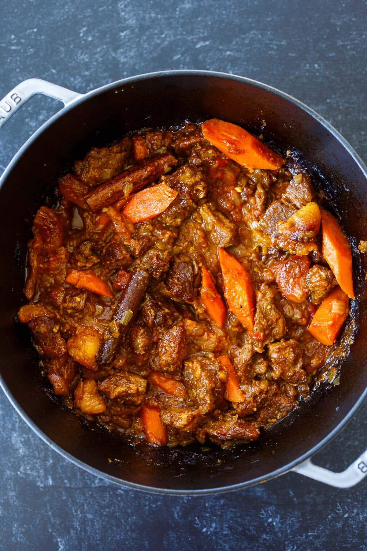 finished lamb tagine with carrots, dried apricots, and cinnamon sticks.