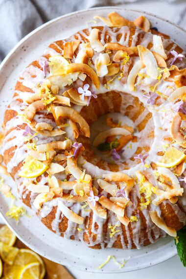 A delicious, easy, one-bowl Lemon Bundt Cake recipe made with coconut milk, drizzled with a tangy lemon glaze. Vegan with a video.