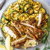Mediterranean Grilled Chicken is an easy, flavor-packed summer dinner made with juicy herb-marinated chicken breasts, charred zucchini, and sweet grilled corn. Bright lemon, garlic, and fresh herbs infuse every bite! Gluten-free.