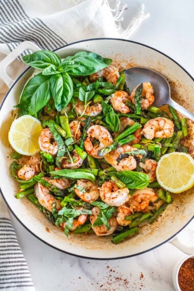 This one-pan shrimp and asparagus recipe is a quick, healthy dinner made with garlic, lemon, and fresh basil, all ready in about 20 minutes. Low-carb, gluten-free.