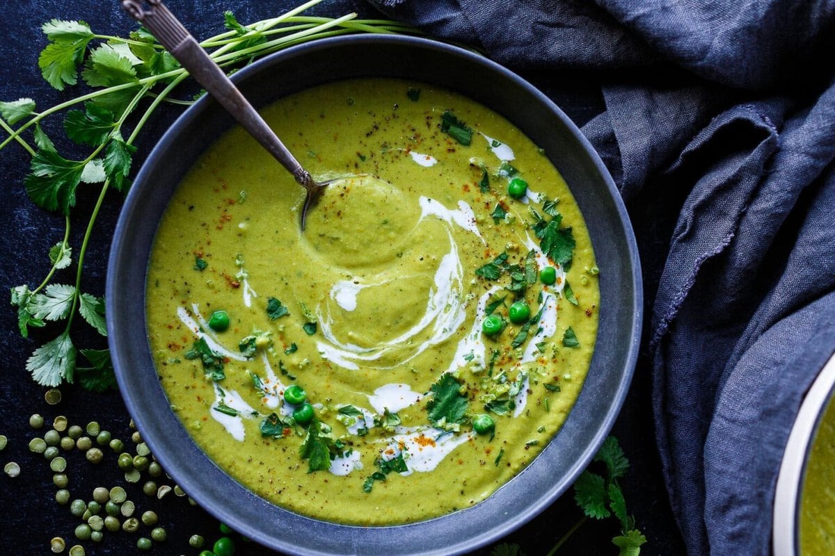 Curried split Pea soup in a bowl with a spoon.