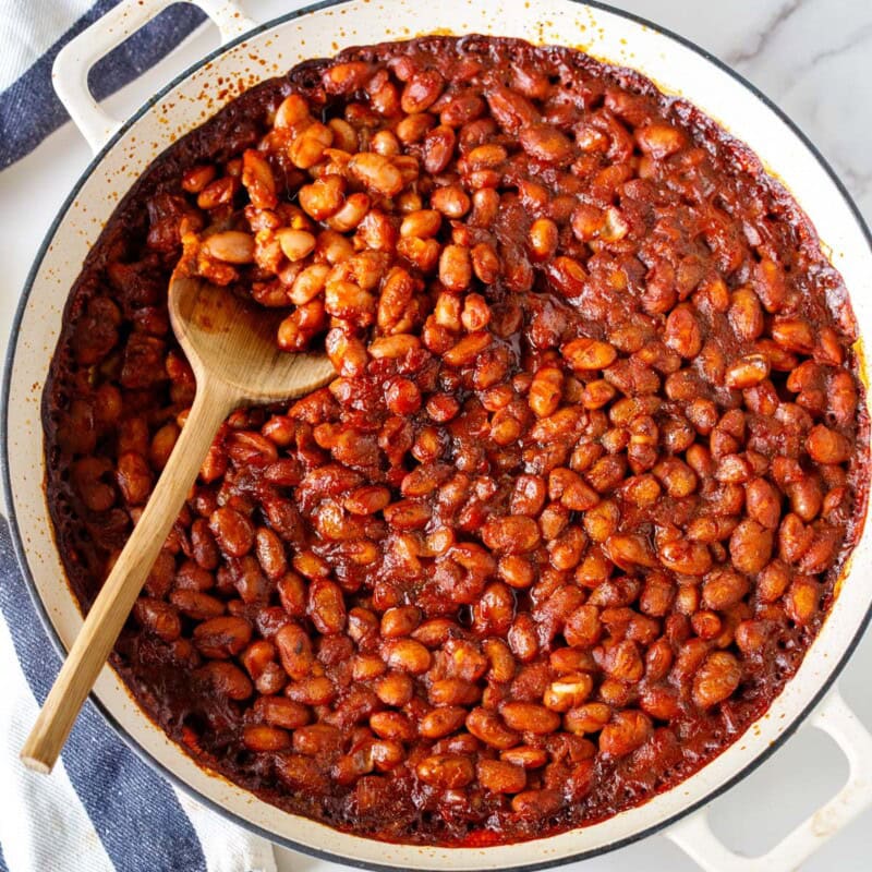 These homemade baked beans are smoky, savory, and easy to make with BBQ sauce, paprika, and tender beans (dry or canned). The perfect vegan BBQ side dish.
