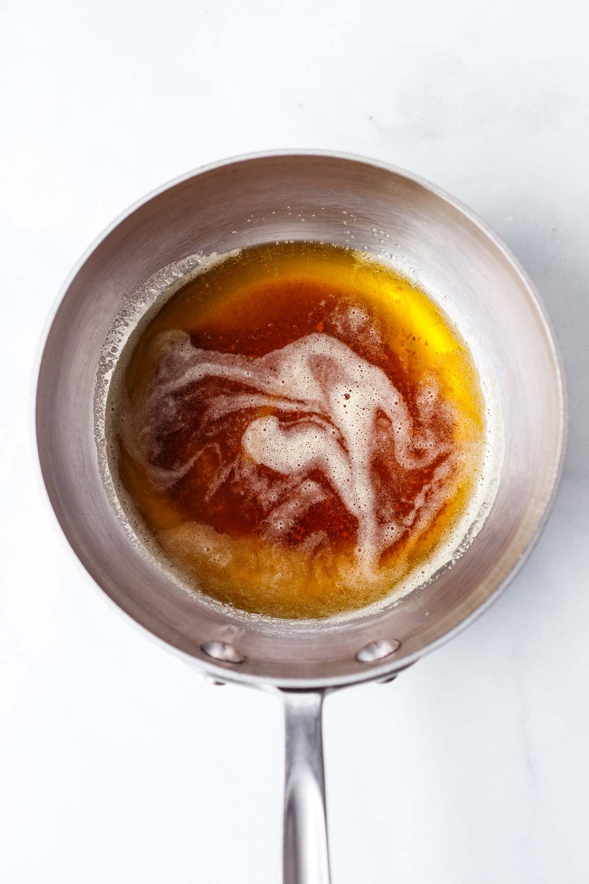 small saucepan with butter melting.