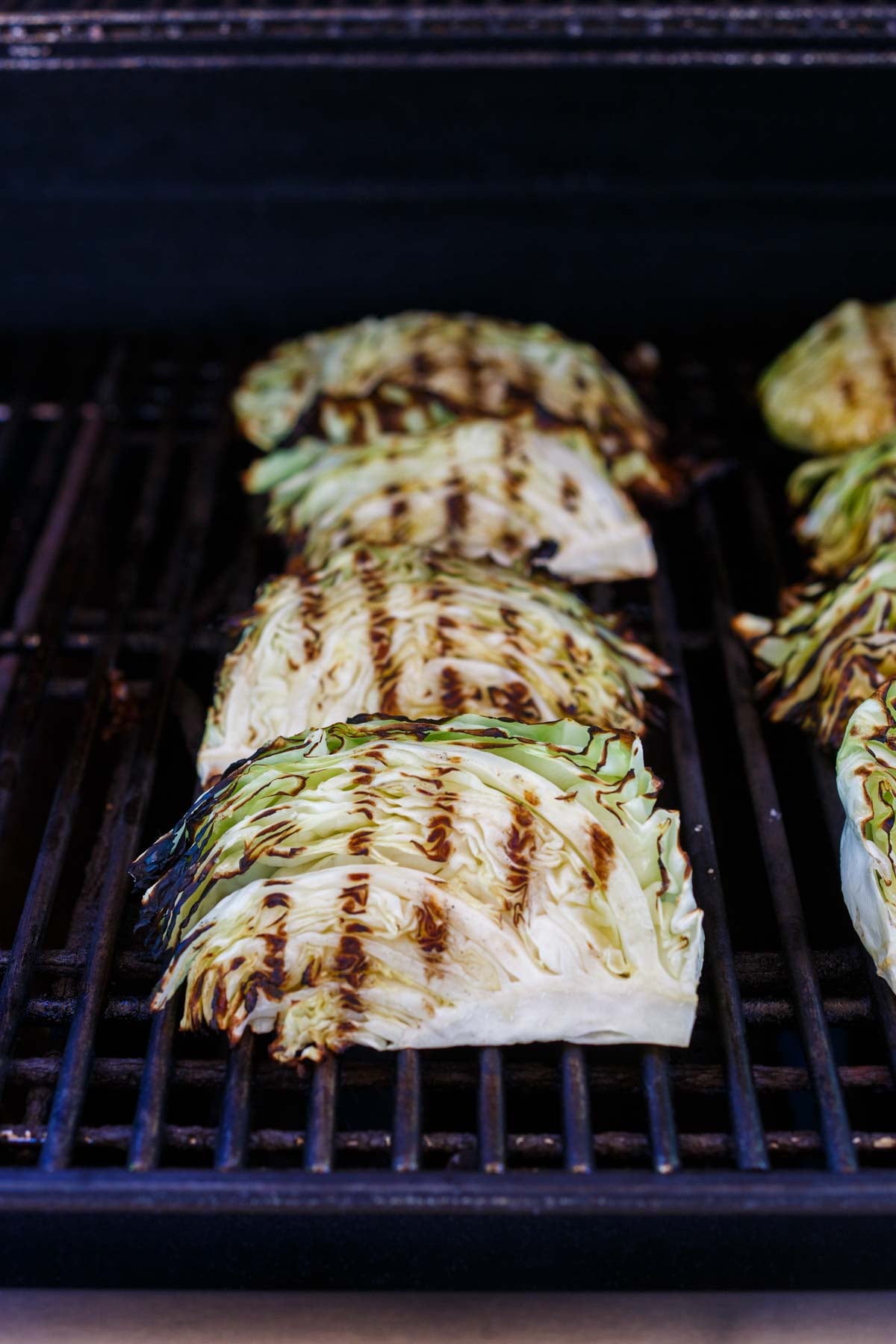 grilled cabbage wedges on the grill.