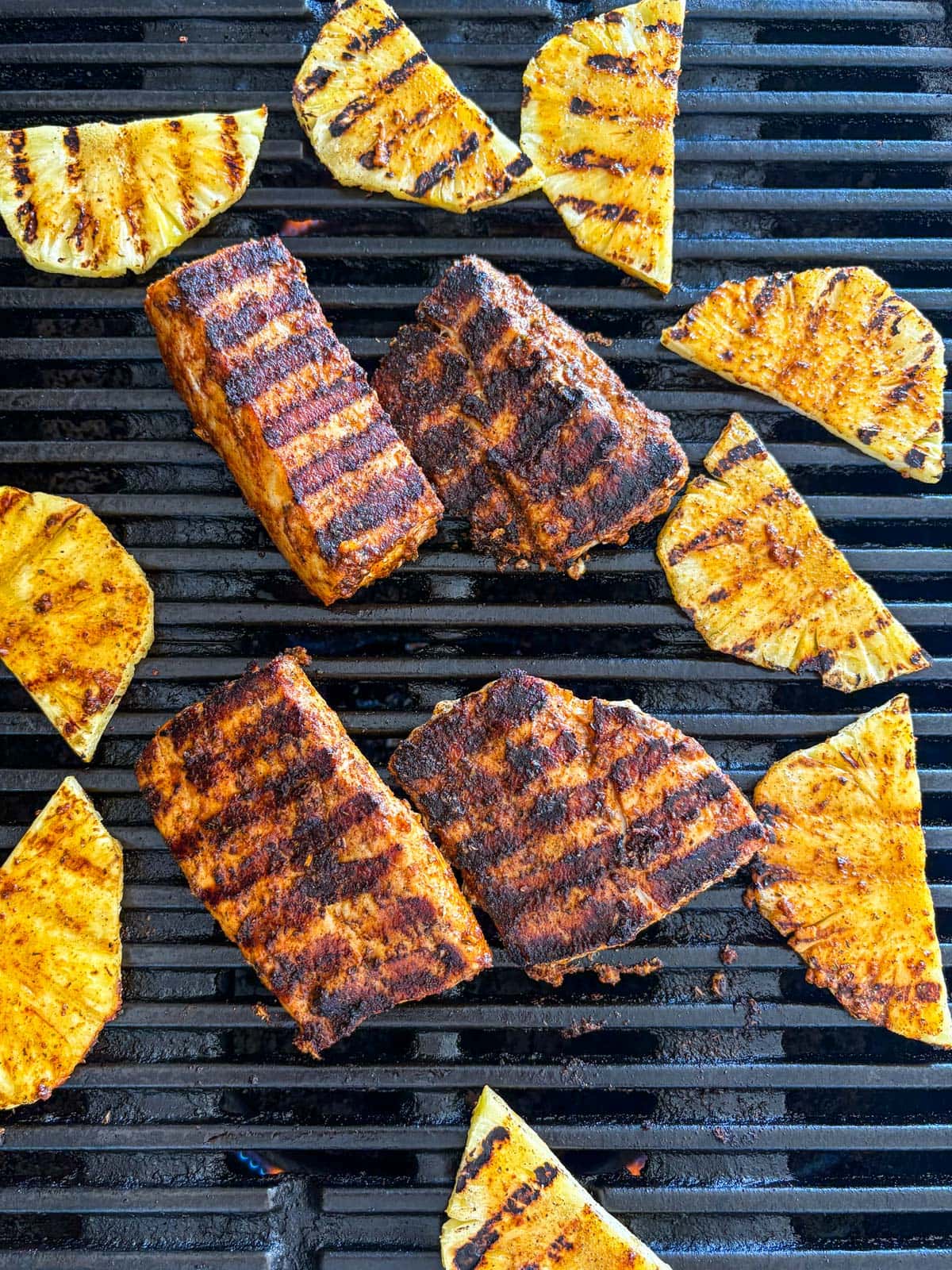 grilled mahi mahi and grilled pineapple on the grill.