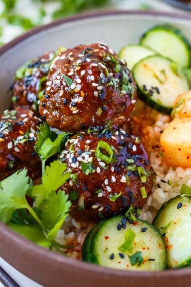 korean meatballs with rice and cucumber salad
