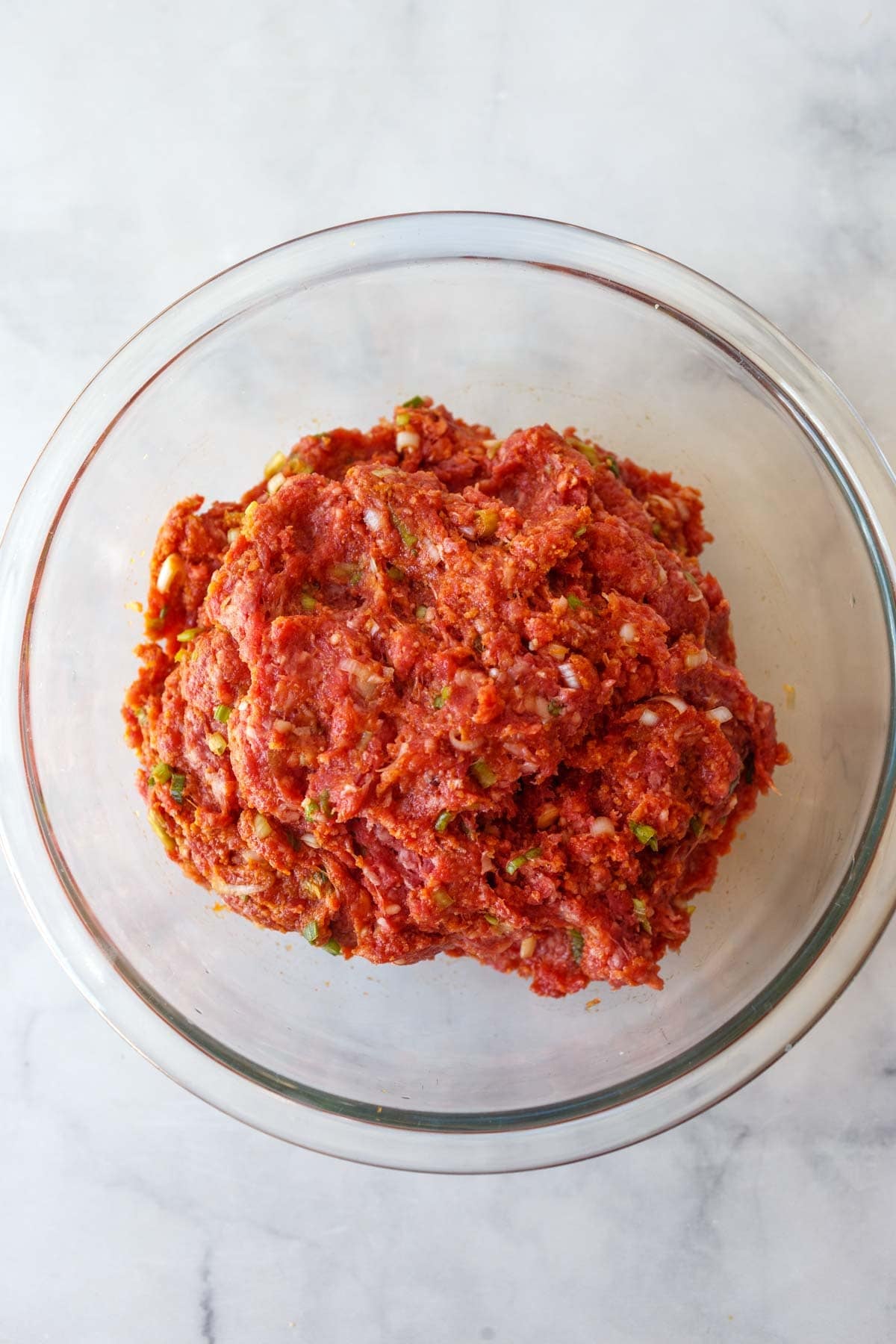 glass bowl with Korean meatball mixture.