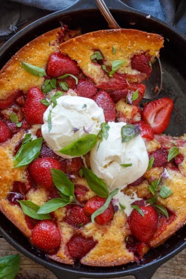 This easy Strawberry Cobbler is the ultimate summer dessert! Juicy fresh strawberries bake beneath a tender, buttery crust until golden and bubbly. Serve it warm with a scoop of vanilla ice cream.