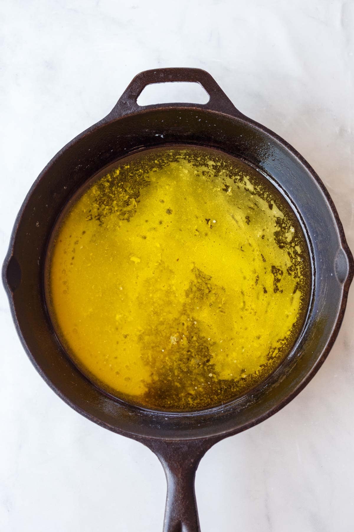 melted butter in a cast iron skillet.