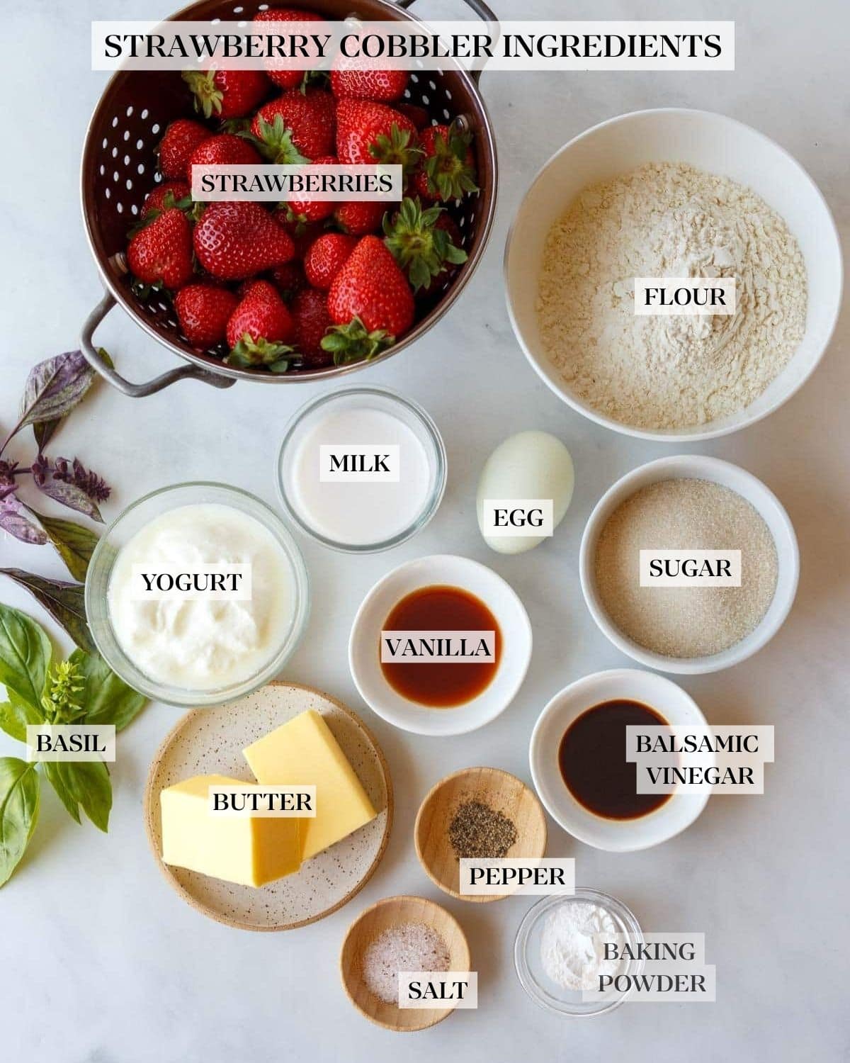 ingredients for strawberry cobbler - strawberries, flour, sugar, egg, milk, yogurt, maple syrup, balsamic, butter, pepper, salt, baking powder.
