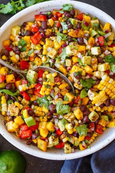 The hardest part about this Black Bean Salad is not eating it straight from the bowl. Sweet mango, creamy avocado, fresh corn, and a zesty lime dressing make every bite taste like summer. Ready in under 30 minutes, a healthy, protein-packed salad for meal prep, potlucks, and easy summer meals.