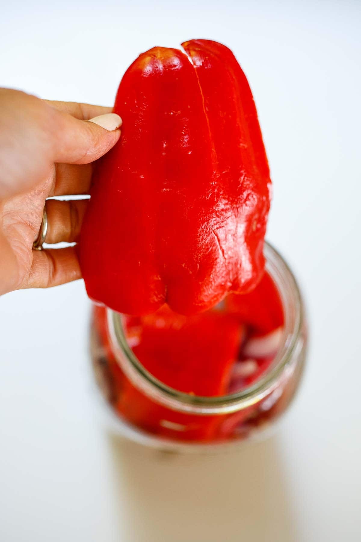Saving a large chili for the top to hold the bottom layers down. 
