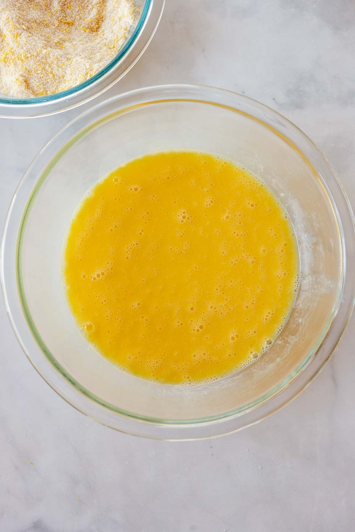 glass bowl with whisked eggs.