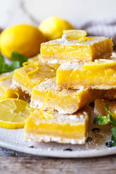 These zesty Lemon Bars have a crisp, buttery shortbread crust and an extra-lemony filling. Tart, bright, and just sweet enough, they're perfect for lemon lovers!