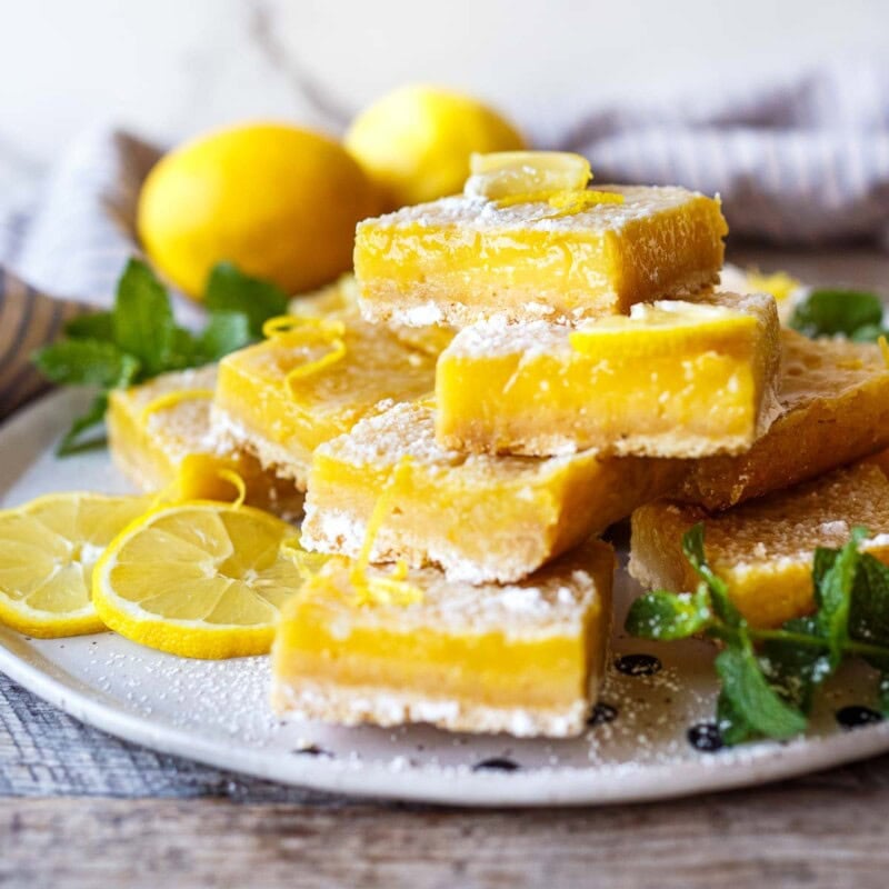 These zesty Lemon Bars have a crisp, buttery shortbread crust and an extra-lemony filling. Tart, bright, and just sweet enough, they're perfect for lemon lovers!
