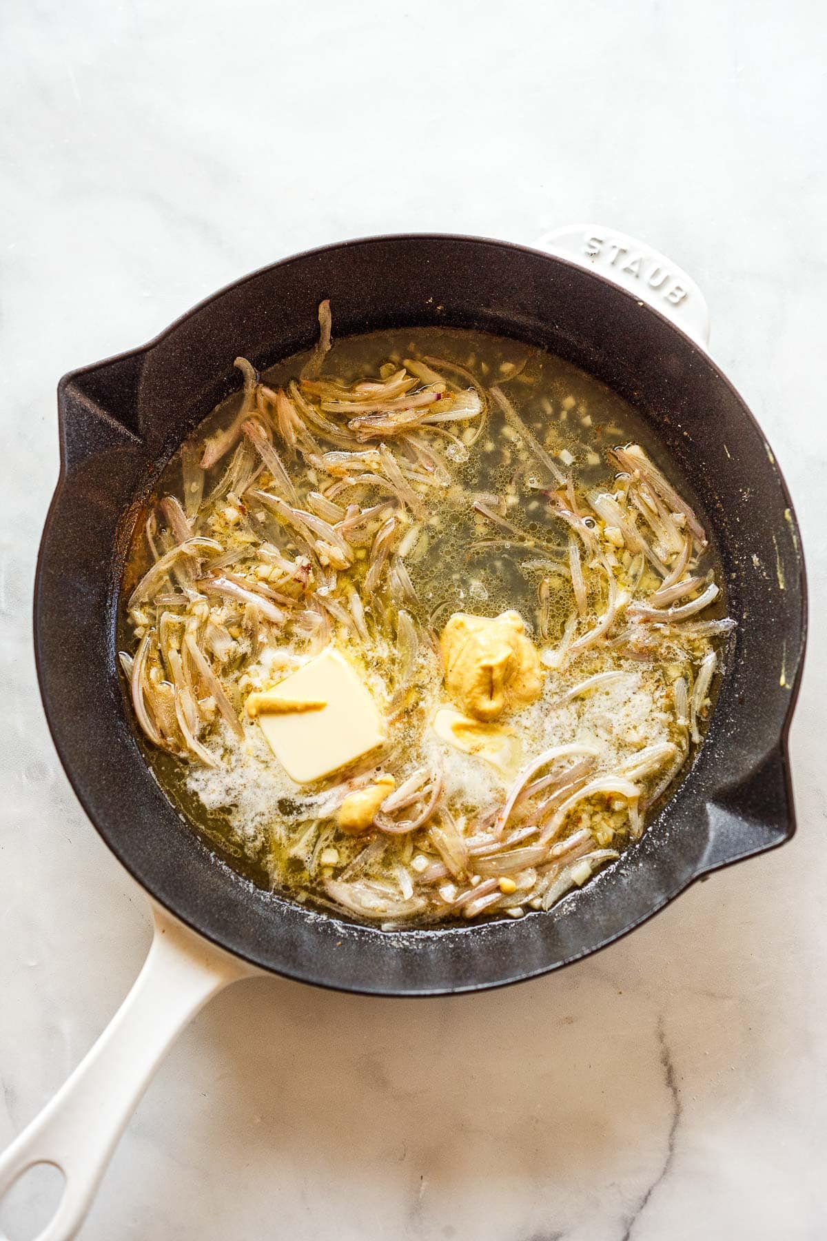 shallots and garlic and butter and Dijon in a skillet to make lemon butter sauce.