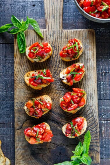This classic Tomato Bruschetta is summer at its best-juicy ripe tomatoes, fresh basil, and crisp toasted bread rubbed with garlic for incredible flavor.