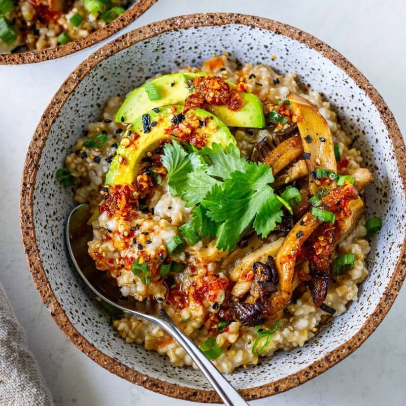 These savory steel-cut oats are creamy, comforting, and full of umami flavor. Top with sautéed mushrooms, avocado, jammy eggs, chili crisp, and furikake for a satisfying breakfast that's perfect for meal prep.