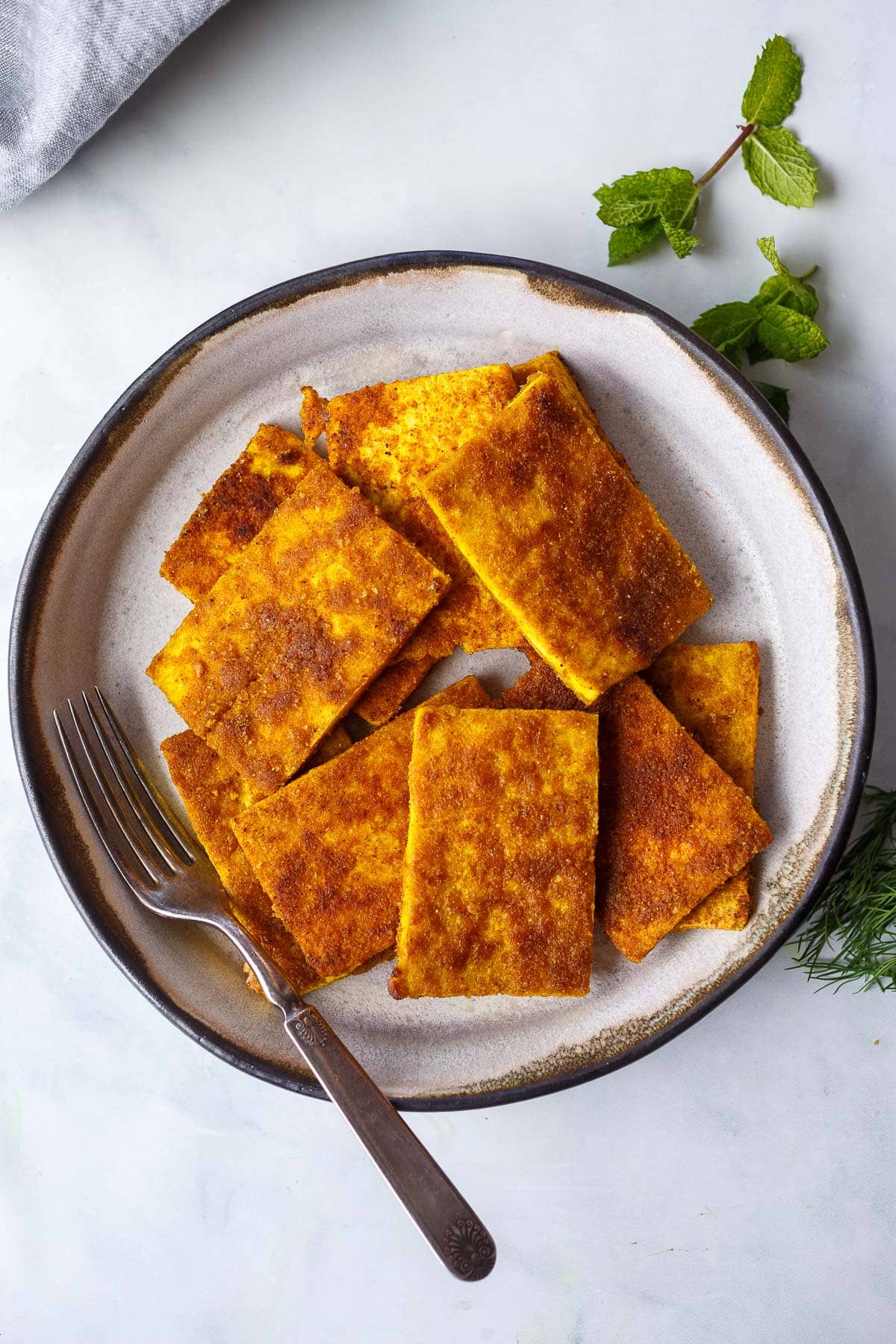 shawarma tofu on a plate with a fork.