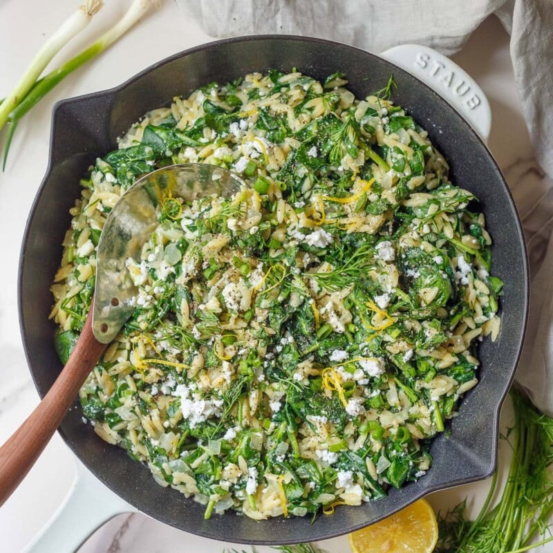 This easy Spanakopita Orzo is a creamy one-pan dinner with tender orzo pasta, spinach, feta, fresh dill, and lemon. All the flavors of spanakopita, ready in about 30 minutes!