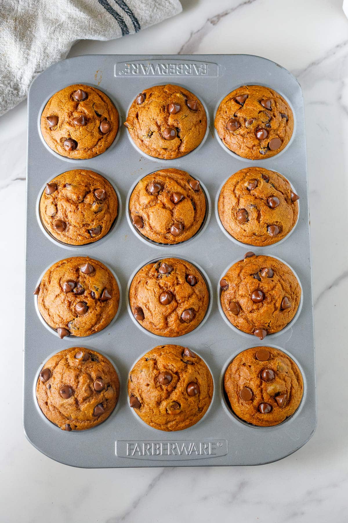 baked pumpkin muffins in muffin tins.